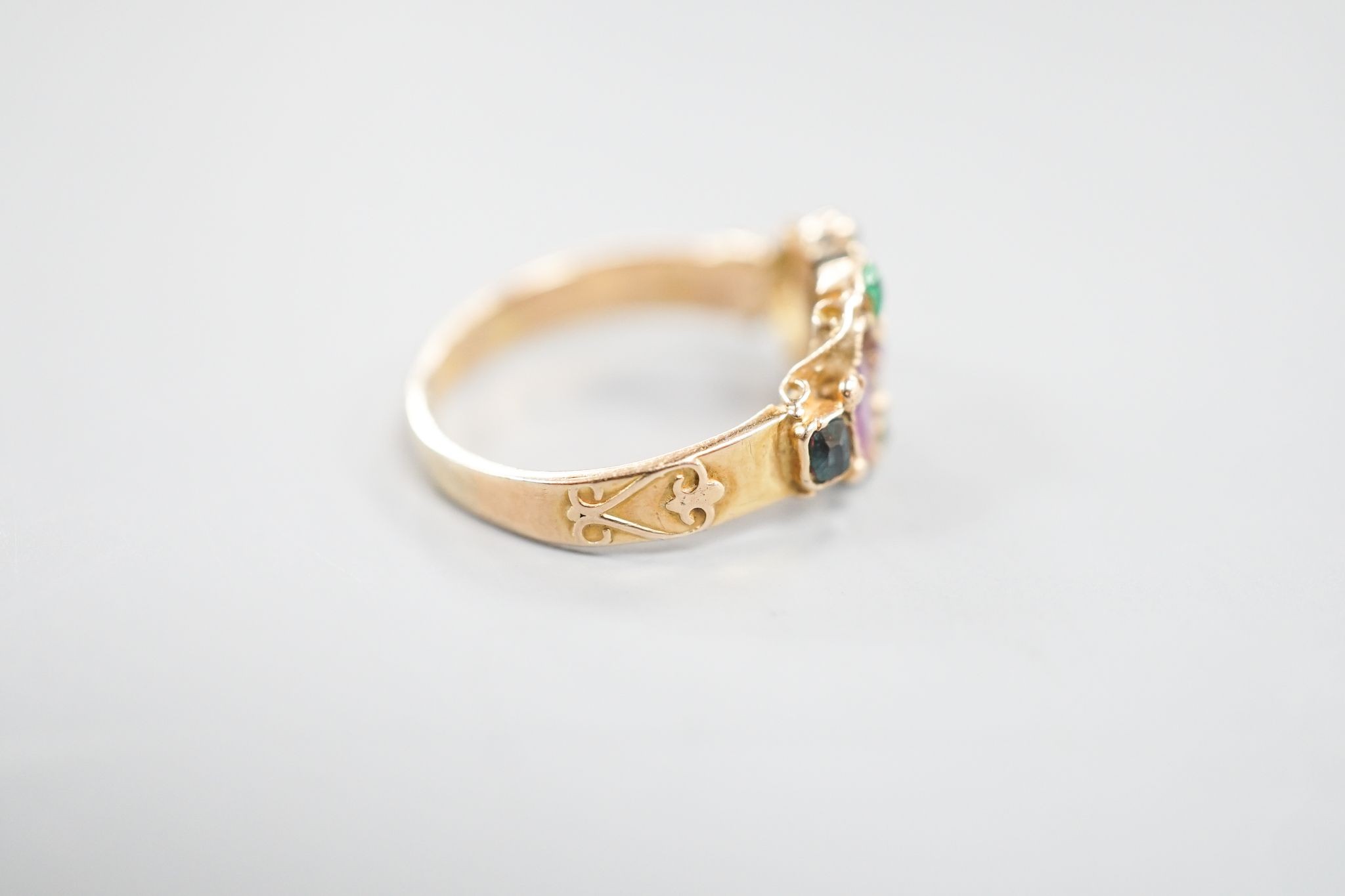 A late Victorian 15ct gold, garnet and emerald set dress ring(stone missing & stone replacement?), size L, gross 2.2grams.